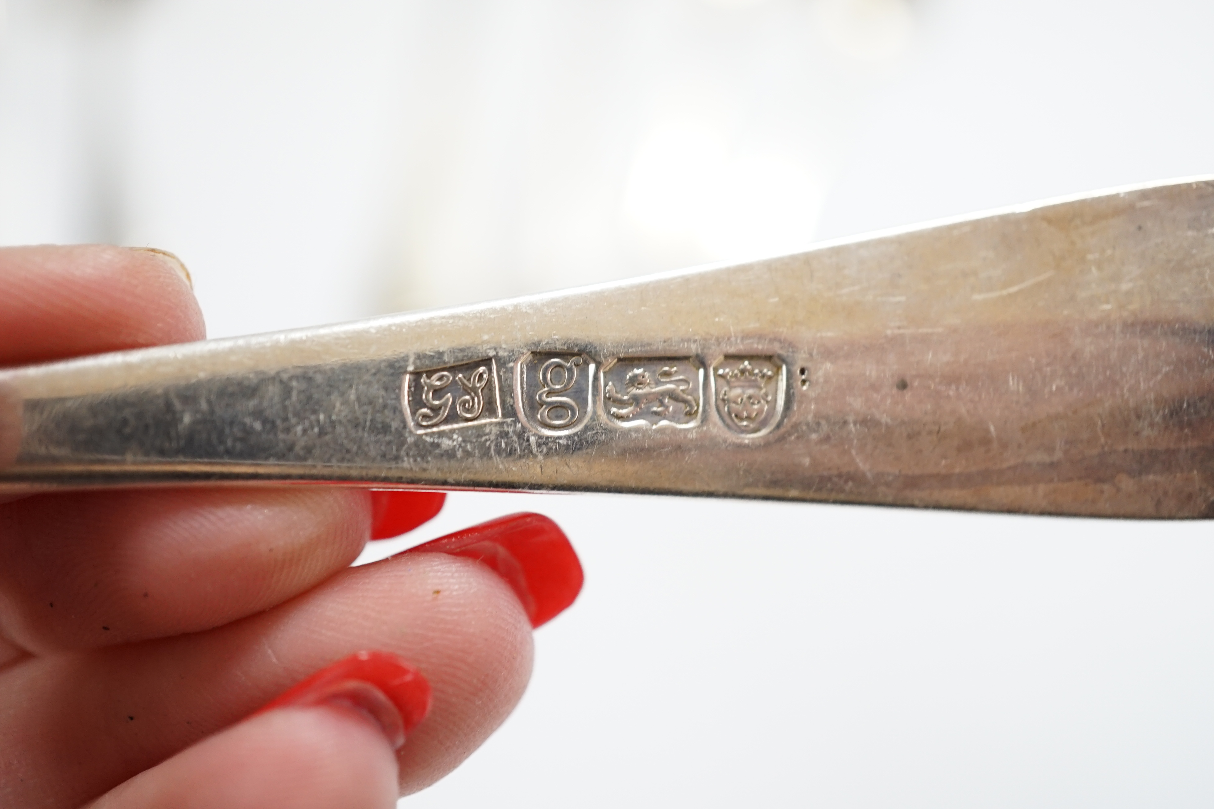 A small quantity of 19th century and later silver flatware, including three pairs of Georgian sugar tongs and nine 19th century and later three pronged forks